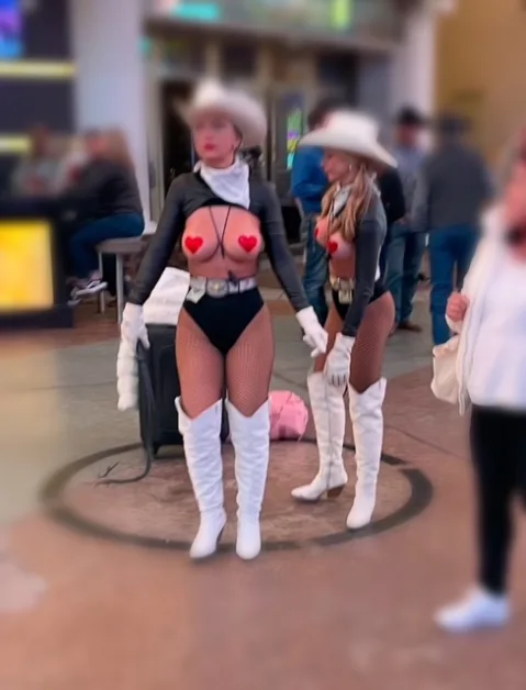 Las Vegas Buskers Pose with tourists and work on tips.